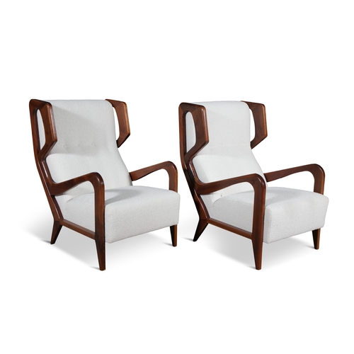 117 - LOUNGE CHAIRS  A pair of lounge chairs in the style of Gio Ponti. Upholstered in bouclé. Italy, c.19... 