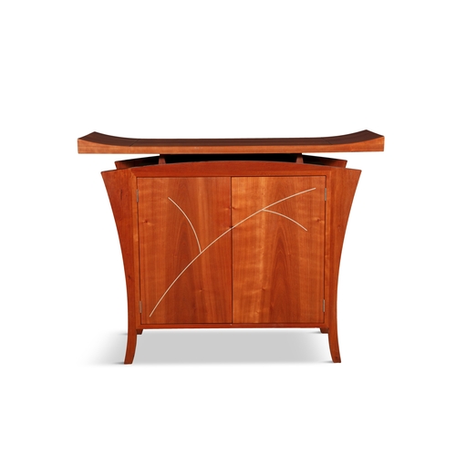 132 - ZELOUF & BELL  A maple two-door side cabinet by Zelouf & Bell. The floating rectangular top with rai... 