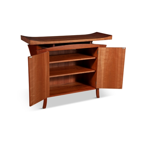 132 - ZELOUF & BELL  A maple two-door side cabinet by Zelouf & Bell. The floating rectangular top with rai... 