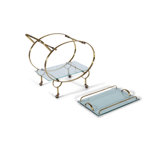 160 - DRINKS TROLLEY  A gilt metal two-tier drinks trolley with glass tops on castors. With removable tray... 