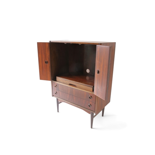 173 - CABINET  A rosewood television cabinet with pull-out swivel tv stand and two drawers. c.1960. 90 x 4... 