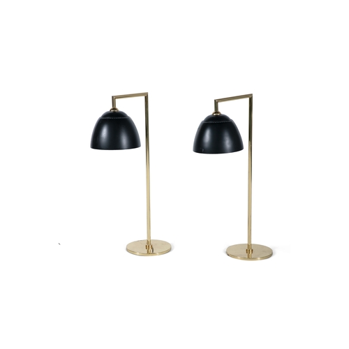 23 - TABLE LAMPS  A pair of gilt metal table lamps with black enamel shades, 71cm(h)