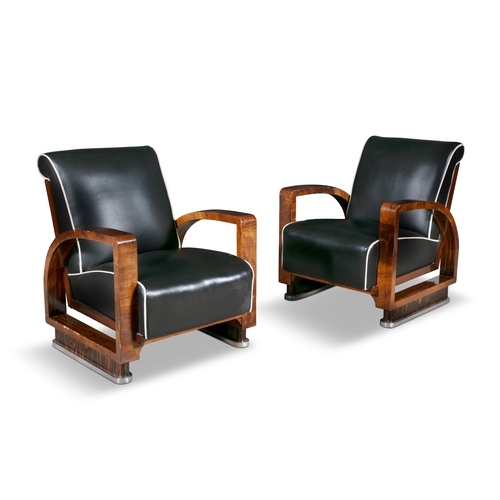 33 - ARMCHAIRS  A pair of Art Deco armchairs in walnut with chrome detailing and leather upholstery. c. 1... 