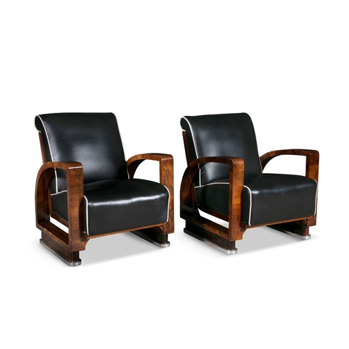 33 - ARMCHAIRS  A pair of Art Deco armchairs in walnut with chrome detailing and leather upholstery. c. 1... 