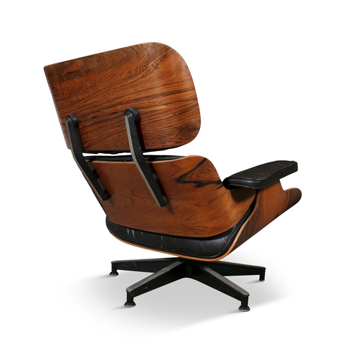 62 - LOUNGE CHAIR  A rosewood lounge chair and footstool by Charles and Ray Eames. c.1970. 85 x 83 x 85cm... 