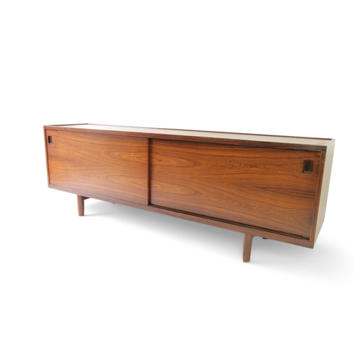 8 - NIELS OTTO MOLLER (1920 - 1982)  A rosewood sideboard by Niels Otto Møller with two sliding doors. D... 