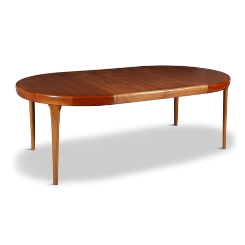 41 - IB KOFOD-LARSEN (1921 - 2003)  A teak circular extending dining table by Ib Kofod-Larsen for Faarup ... 