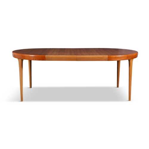 41 - IB KOFOD-LARSEN (1921 - 2003)  A teak circular extending dining table by Ib Kofod-Larsen for Faarup ... 