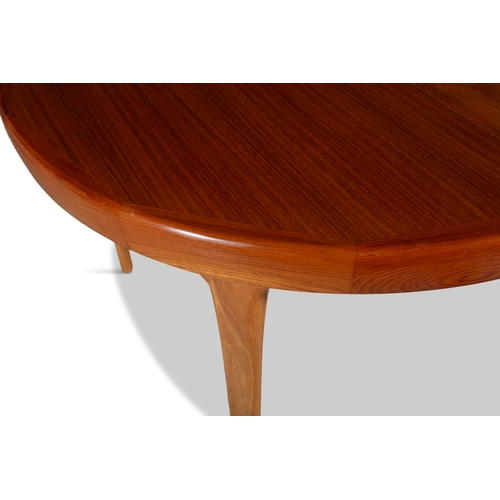 41 - IB KOFOD-LARSEN (1921 - 2003)  A teak circular extending dining table by Ib Kofod-Larsen for Faarup ... 