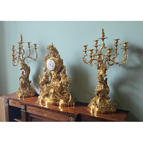 712A - ***ADDITIONAL LOT*** A FRENCH ROCOCO STYLE THREE-PIECE ORMOLU CLOCK GARNITURE,  inscribed 'Ch. Drieu... 