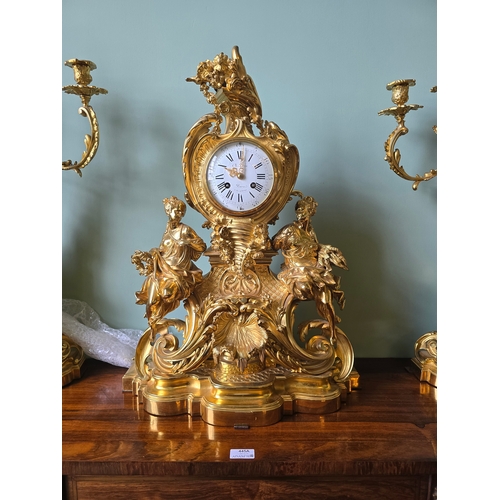 712A - ***ADDITIONAL LOT*** A FRENCH ROCOCO STYLE THREE-PIECE ORMOLU CLOCK GARNITURE,  inscribed 'Ch. Drieu... 