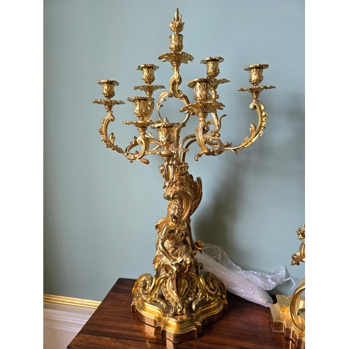 712A - ***ADDITIONAL LOT*** A FRENCH ROCOCO STYLE THREE-PIECE ORMOLU CLOCK GARNITURE,  inscribed 'Ch. Drieu... 