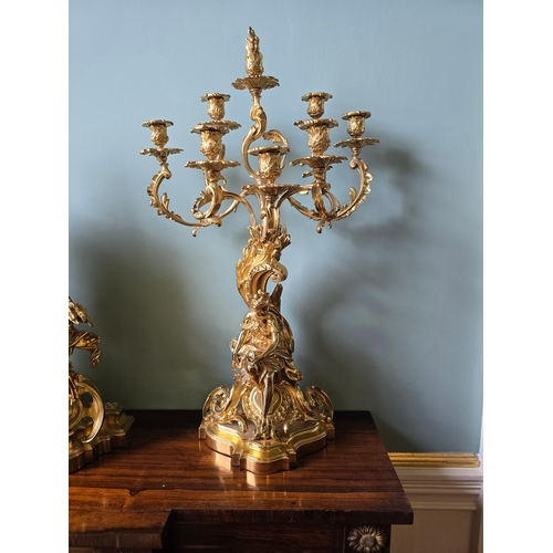 712A - ***ADDITIONAL LOT*** A FRENCH ROCOCO STYLE THREE-PIECE ORMOLU CLOCK GARNITURE,  inscribed 'Ch. Drieu... 