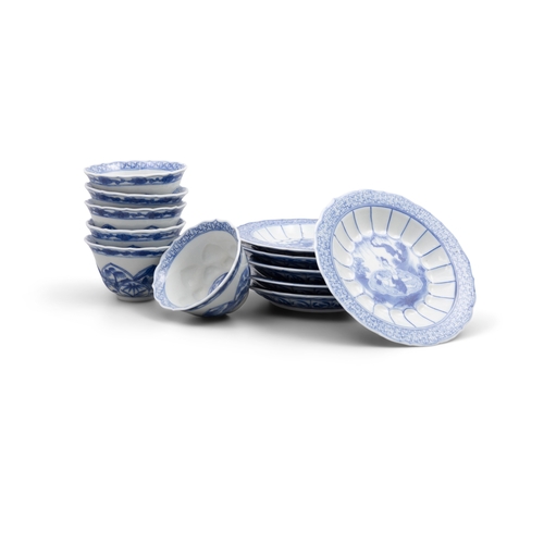 252 - A SET OF SIX  BLUE AND WHITE TEACUPS AND SAUCERS OF SHAPED FOLIATE RIMS  清康熙 青花春宫杯碟一套六件  depicting e... 