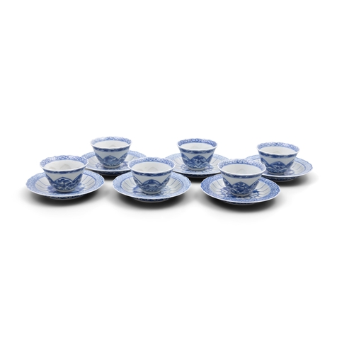 252 - A SET OF SIX  BLUE AND WHITE TEACUPS AND SAUCERS OF SHAPED FOLIATE RIMS  清康熙 青花春宫杯碟一套六件  depicting e... 