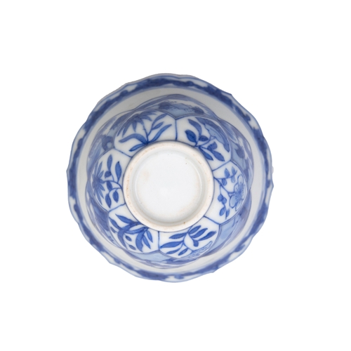 252 - A SET OF SIX  BLUE AND WHITE TEACUPS AND SAUCERS OF SHAPED FOLIATE RIMS  清康熙 青花春宫杯碟一套六件  depicting e... 