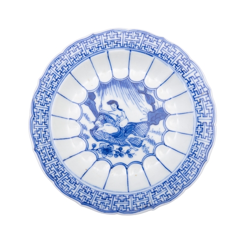 252 - A SET OF SIX  BLUE AND WHITE TEACUPS AND SAUCERS OF SHAPED FOLIATE RIMS  清康熙 青花春宫杯碟一套六件  depicting e... 