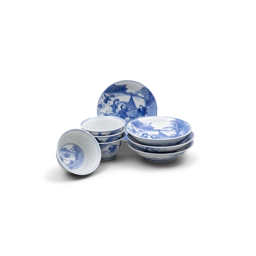 256 - A SET OF FOUR BLUE AND WHITE TEACUPS AND SAUCERS, MARK ZHEN YU TANG  清康熙 珍玉堂款 青花农家乐杯碟一组四套  depicting... 