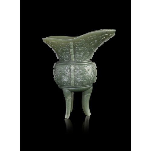 305 - AN ARCHAISTIC SPINACH-GREEN JADE JUE VESSEL  民国 碧玉爵杯  China, Republic period (1912-1948)  formed as ... 