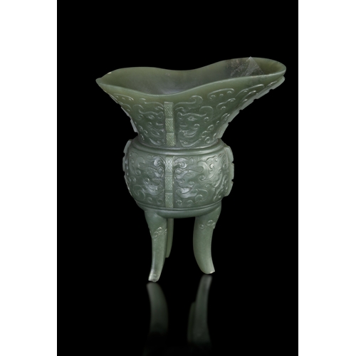 305 - AN ARCHAISTIC SPINACH-GREEN JADE JUE VESSEL  民国 碧玉爵杯  China, Republic period (1912-1948)  formed as ... 