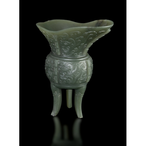 305 - AN ARCHAISTIC SPINACH-GREEN JADE JUE VESSEL  民国 碧玉爵杯  China, Republic period (1912-1948)  formed as ... 