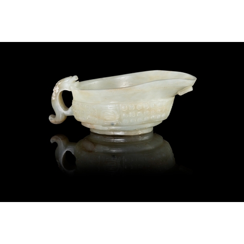 309 - A CELADON ARCHAISTIC LIBATION ‘YI’ VESSEL  民国 青玉乳钉纹螭龙单耳匜  China, Republic period  the exterior of th... 