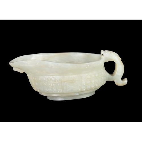 309 - A CELADON ARCHAISTIC LIBATION ‘YI’ VESSEL  民国 青玉乳钉纹螭龙单耳匜  China, Republic period  the exterior of th... 