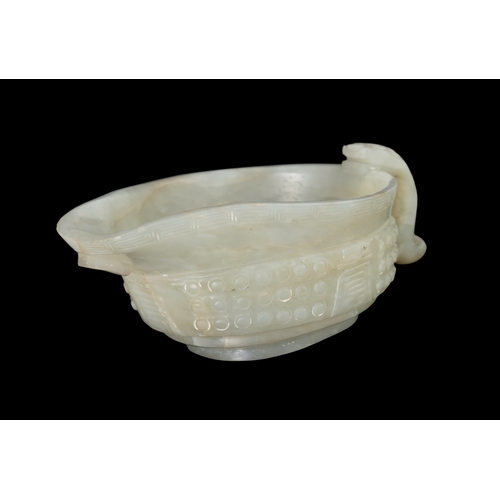 309 - A CELADON ARCHAISTIC LIBATION ‘YI’ VESSEL  民国 青玉乳钉纹螭龙单耳匜  China, Republic period  the exterior of th... 