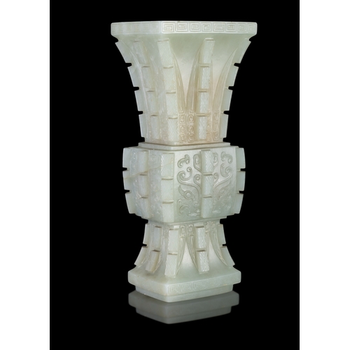 311 - AN ARCHAISTIC CELADON JADE FANG GU VASE  晚清-民国 青玉饕餮纹出戟出戟方觚  China, late Qing - Republic period  of a... 