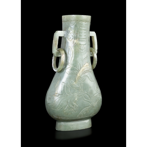 312 - A SPINACH-GREEN JADE PEAR SHAPE VASE  明代 碧玉寿字纹双耳活环瓶  China, Ming dynasty (1368-1644)  of flattened p... 