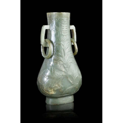 312 - A SPINACH-GREEN JADE PEAR SHAPE VASE  明代 碧玉寿字纹双耳活环瓶  China, Ming dynasty (1368-1644)  of flattened p... 