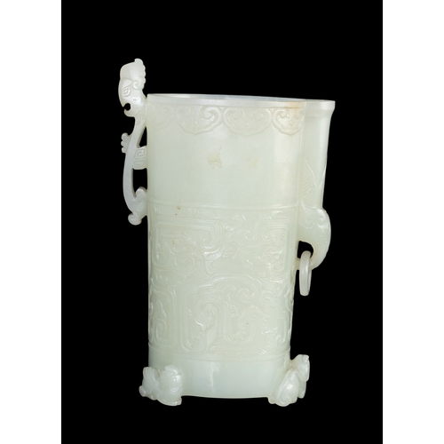 313 - A RARE PALE GREENISH-WHITE JADE ARCHAISTIC FOOTED CUP  明代 青白玉仿古三足凤鸟杯  China, Ming dynasty (1368-1644... 