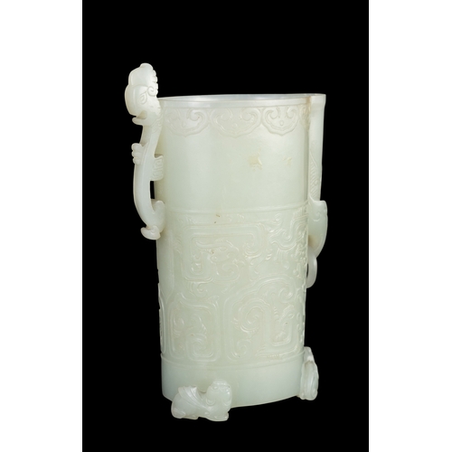 313 - A RARE PALE GREENISH-WHITE JADE ARCHAISTIC FOOTED CUP  明代 青白玉仿古三足凤鸟杯  China, Ming dynasty (1368-1644... 