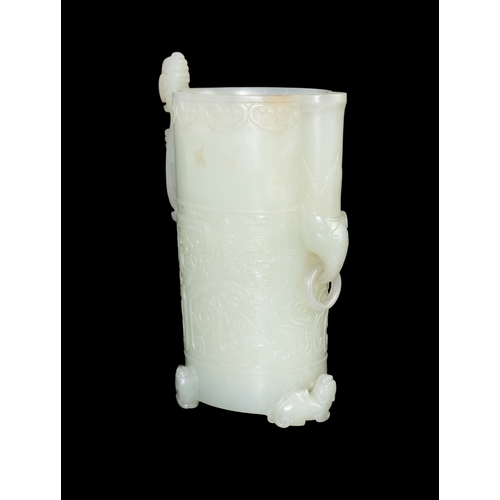 313 - A RARE PALE GREENISH-WHITE JADE ARCHAISTIC FOOTED CUP  明代 青白玉仿古三足凤鸟杯  China, Ming dynasty (1368-1644... 