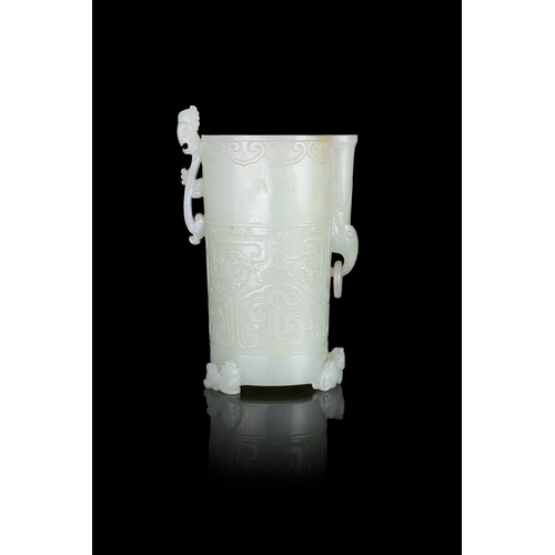 313 - A RARE PALE GREENISH-WHITE JADE ARCHAISTIC FOOTED CUP  明代 青白玉仿古三足凤鸟杯  China, Ming dynasty (1368-1644... 