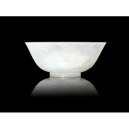 314 - A FINELY CARVED JADEITE BOWL  民国 翡翠芍药花纹碗  China, Republic period (1912-1944)  With shallow curved si... 