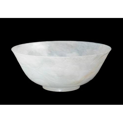 314 - A FINELY CARVED JADEITE BOWL  民国 翡翠芍药花纹碗  China, Republic period (1912-1944)  With shallow curved si... 