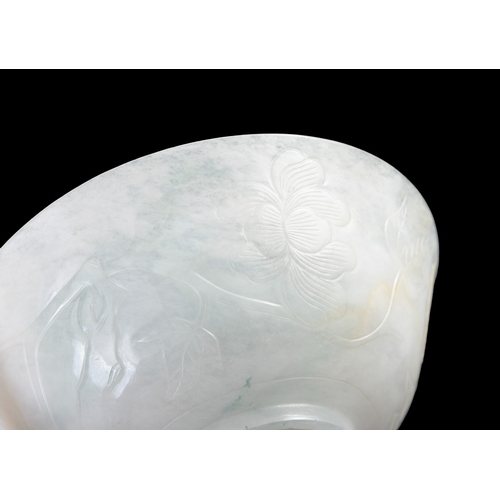 314 - A FINELY CARVED JADEITE BOWL  民国 翡翠芍药花纹碗  China, Republic period (1912-1944)  With shallow curved si... 