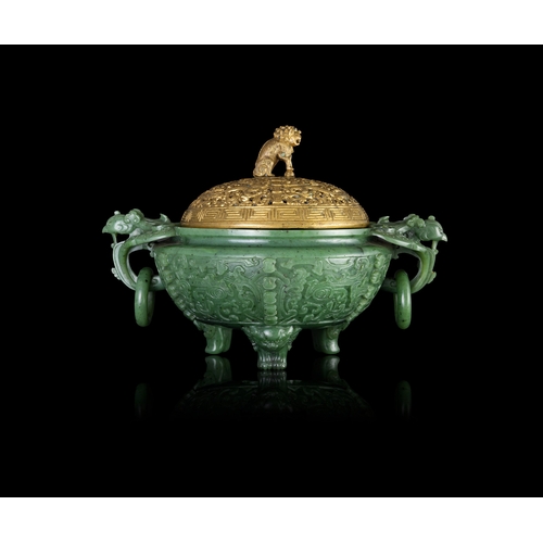 316 - A SPINACH-GREEN JADE ARCHAISTIC TRIPOD INCENSE BURNER  19世纪 碧玉仿古凤鸟纹双耳活环三足炉  China, 19th century  The... 