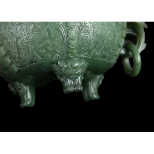 316 - A SPINACH-GREEN JADE ARCHAISTIC TRIPOD INCENSE BURNER  19世纪 碧玉仿古凤鸟纹双耳活环三足炉  China, 19th century  The... 