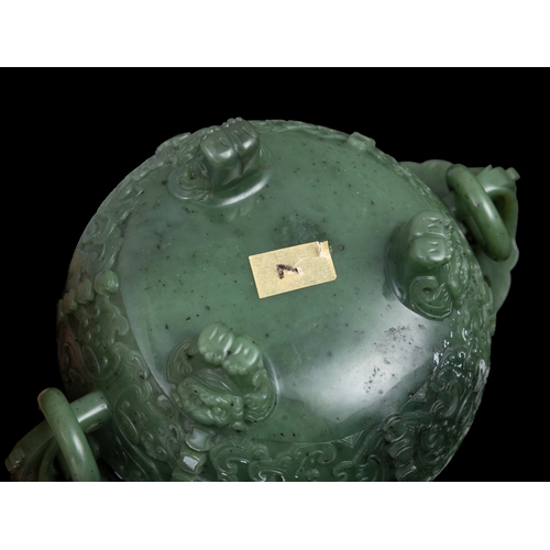 316 - A SPINACH-GREEN JADE ARCHAISTIC TRIPOD INCENSE BURNER  19世纪 碧玉仿古凤鸟纹双耳活环三足炉  China, 19th century  The... 