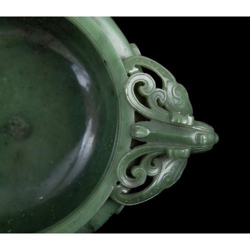 316 - A SPINACH-GREEN JADE ARCHAISTIC TRIPOD INCENSE BURNER  19世纪 碧玉仿古凤鸟纹双耳活环三足炉  China, 19th century  The... 