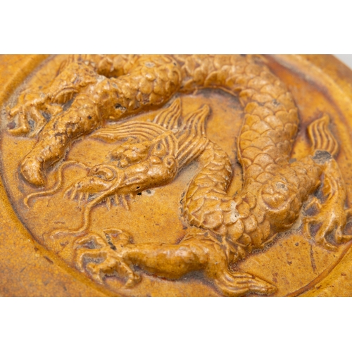 330 - A YELLOW GLAZED POTTERY 'DRAGON' ROOF TILE   明代 琉璃黄釉行龙瓦当   China, Ming dynasty (1368-1644)   D.17.8c... 