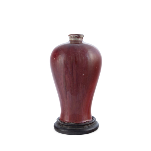 351 - A RED GLAZED MEIPING VASE WITH WOOD STAND, MARK QIANLONG   20世纪初 乾隆款红釉小梅瓶 带木座   China, early 20th ce... 