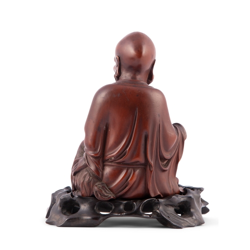 385 - A CARVED BOXWOOD FIGURE OF AN ASCETIC  清代 黃楊木羅漢  China, Qing dynasty  H.10.2cm without stand