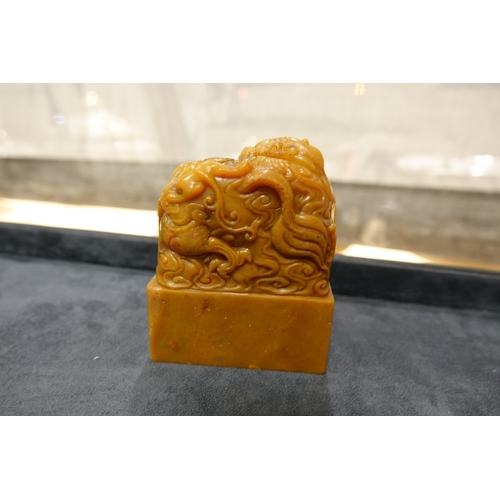 386 - AN INSCRIBED AND DATED 'XIN TIAN ZHU REN' SOAPSTONE SEAL,   清代 双龙教子钮 ‘信天主人’寿山石印章  of rectangular for... 