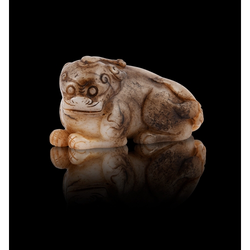 445 - A BROWNISH JADE LAYING TIGER  清末民初 玉虎  Late Qing – Republic period  L.8.5cm  H.4.9cm