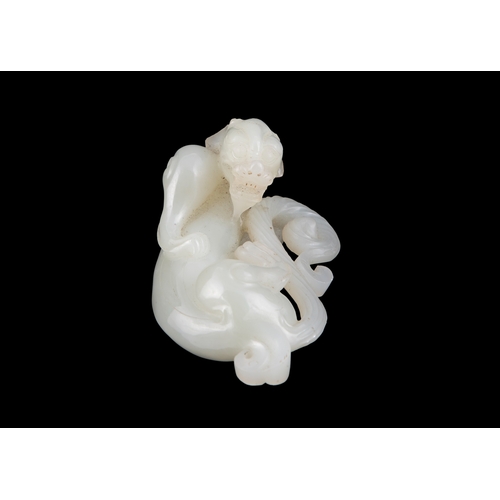 453 - A CELADON JADE LAYING CHILONG   清代 青白玉透雕螭龙   China, Qing dynasty   L.8.3cm