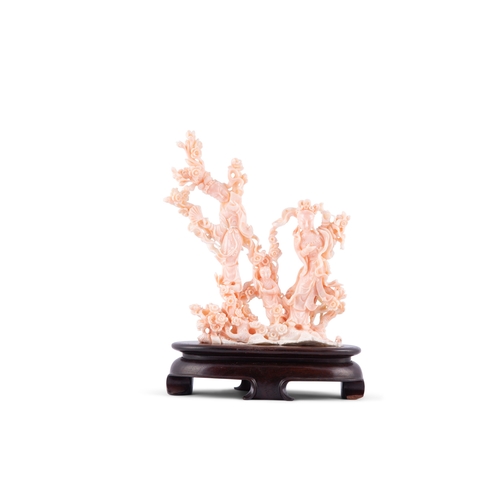 458 - *A PEAU D'ANGE CORAL GROUP OF TWO FEMAIL FIGRUES AND A CHILD ON A WOODEN STAND  China, 20th century ... 