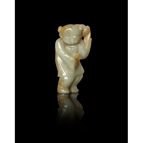 465 - A CELADON AND RUSSET JADE FIGURE HOLDING A FISH  清代 青玉年年有余童子  China, Qing dynasty  7.2cm